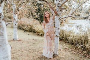 Woman wearing a dress in a park photo