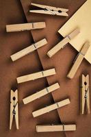 Clothespins on brown paper photo