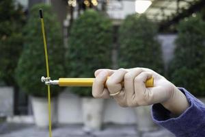 Hand of woman holding a speed jump rope photo