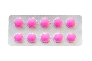 Pink pills in a blister pack isolated on a white background photo