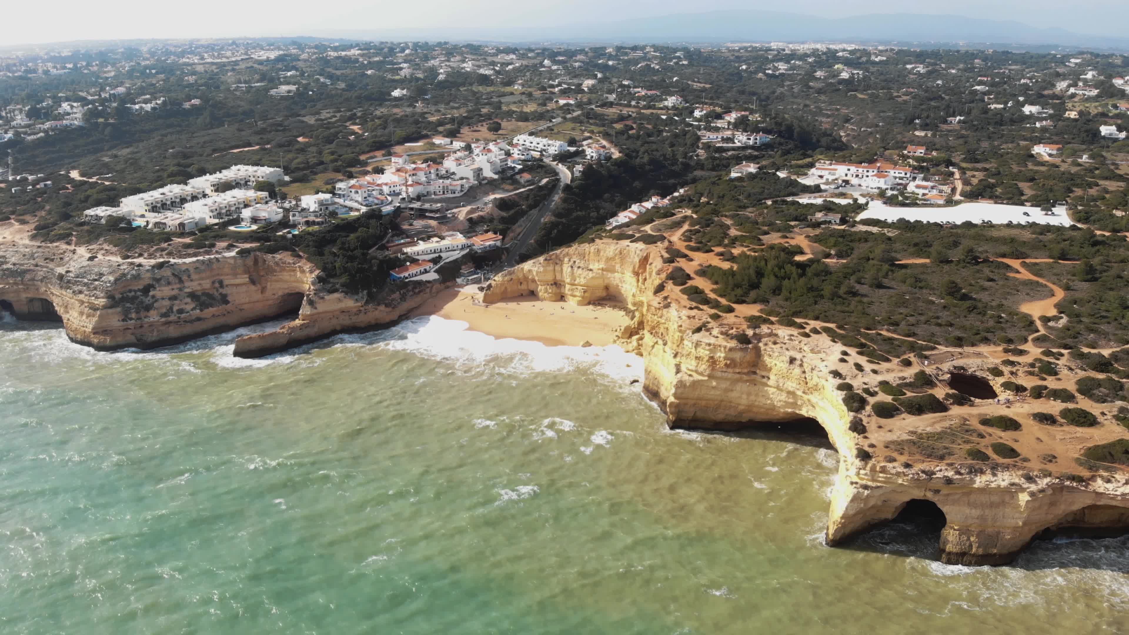 Frivillig igennem halstørklæde Panning aerial 4k drone footage of the cliffs, rock formations, and beaches  near the coastal village of Benagil, Portugal. 2135935 Stock Video at  Vecteezy