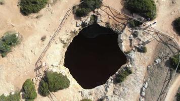 Algar De Benagil secret Cave, outside hole - Birds eye view Aerial shot video