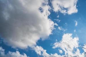 Cumulus clouds in a blue sky photo