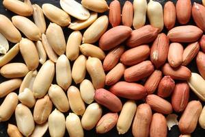 Shelled peanuts for food background photo