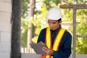 Architectural Engineer inspects quality control on site building photo