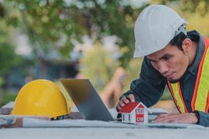 Architectural Engineer designs building construction for a house project photo