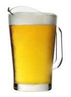 Pitcher of beer with foam photo