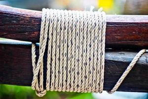 Rope on a wooden surface photo