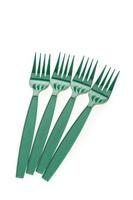 Green plastic forks on white background photo