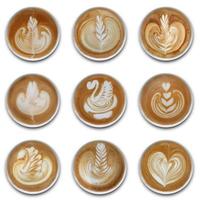 Collection of mugs of latte art coffee on white background photo