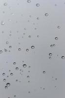 Water drops on a glass vertical background photo