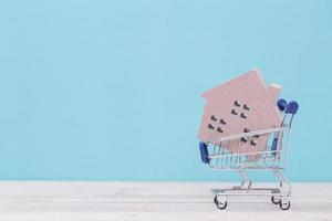 Wood house in a shopping cart photo