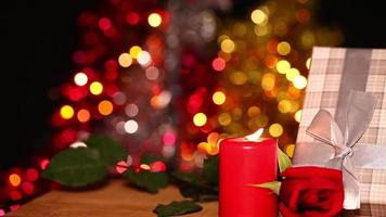 Gift Box and Red Candle and Colorful Bokeh in Background video