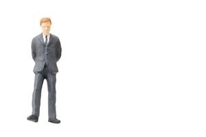 Miniature businessman on a white background photo