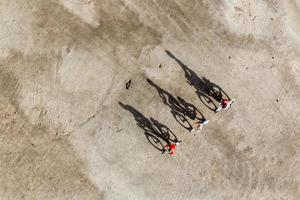 Miniature travelers riding bicycles, healthy lifestyle concept photo