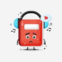 Cute notebook mascot listening to music vector