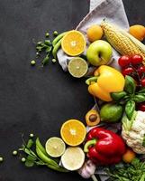 Vegetables and fruits on a black concrete background photo