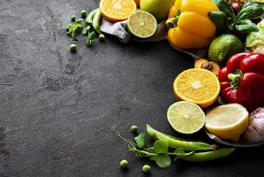 Vegetables and fruits on a black concrete background photo