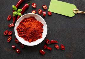 Red chili pepper, dried chillies on dark background photo