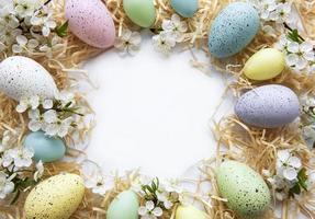 Colorful Easter eggs with spring blossom flowers photo