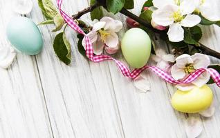 Colorful Easter eggs with spring blossom flowers photo