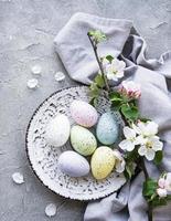 Colorful Easter eggs with spring blossom flowers photo