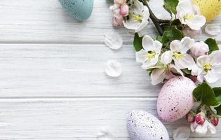 Colorful Easter eggs with spring blossom flowers photo