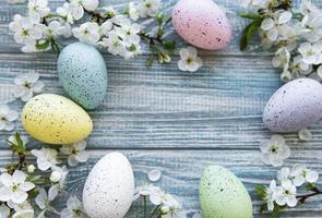 Colorful Easter eggs with spring blossom flowers photo