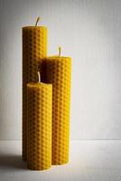 Three beeswax candles photo