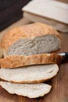 Grain bread on wood table photo