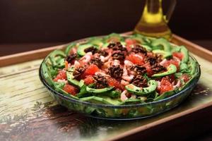 Avocado salad on the plate photo