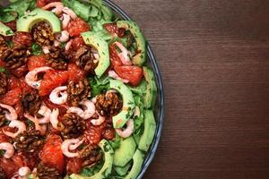 Avocado salad on the plate photo