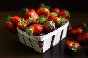 Strawberries on a wooden table photo