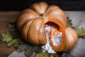 Pumpkin lying on a wooden table photo