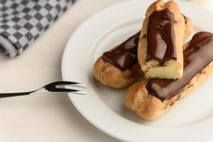 Profiteroles with butter cream photo