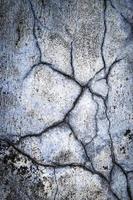 Detail of old blue plaster with cracks photo