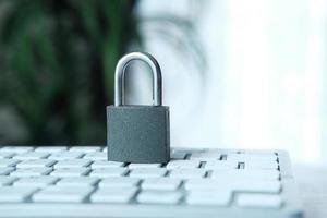 Internet safety concept with padlock on a computer keyboard photo