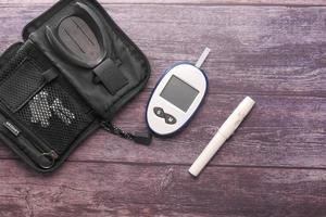 Close up of diabetic measurement tools on wooden background photo