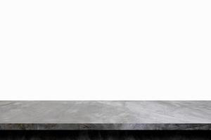 Mesa de cemento gris, piso de concreto y estante para exhibir el producto. foto