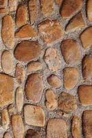 Brown stone wall textured background photo