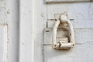 White wooden front door of a house photo