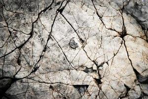 Cracked old limestone photo