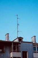 antenna tv on the rooftop of the house photo