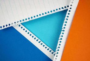Colored papers in the shape of a triangle photo