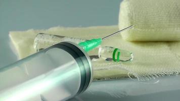 Injector Needle and Medicine on Gauze Bandage video