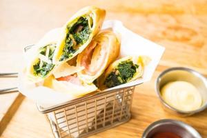 Fried spring roll with ham cheese and spinach vegetable photo