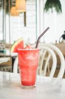 Iced watermelon juice in glass photo