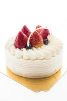 Vanilla cream cake with strawberry on top photo