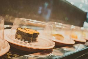 Sushi tray on conveyor belt photo