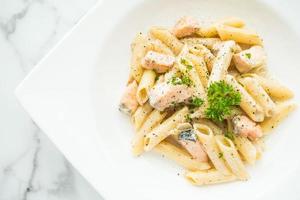 Penne carbonara pasta with salmon photo